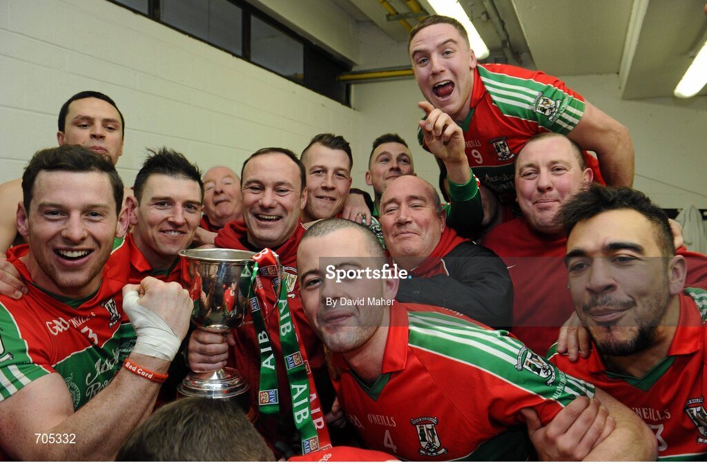 9 December 2012; Ballymun Kickhams manager Paul Curran, fourth from left, celebrates with players in the dressing room at the end of the game. AIB Leinster GAA Football Senior Club Championship Final, Portlaoise, Laois v Ballymun Kickhams, Dublin, Cusack Park, Mullingar, Co. Westmeath. Picture credit: David Maher / SPORTSFILE