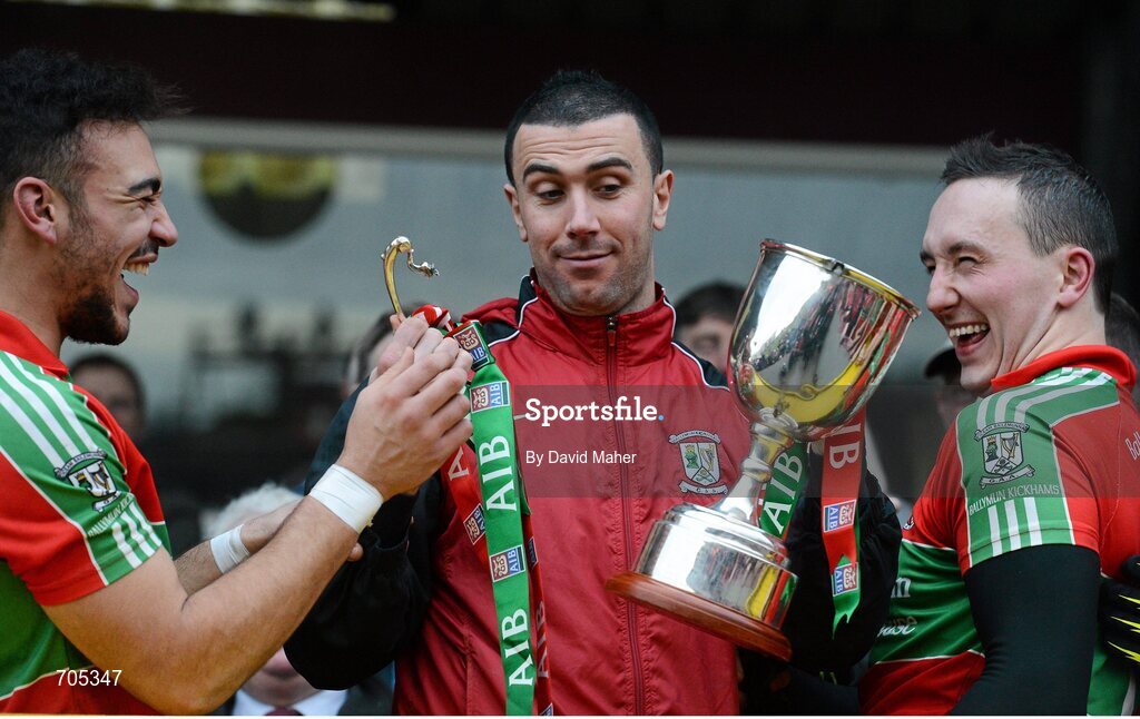 9 December 2012; Simon Lawlor, centre, Ballymun Kickhams, along with Ted Furman, left, and Kevin Leahy, right, holds the McCabe Cup in his left hand and the handle in his right, after it came apart during the presentation. AIB Leinster GAA Football Senior Club Championship Final, Portlaoise, Laois v Ballymun Kickhams, Dublin, Cusack Park, Mullingar, Co. Westmeath. Picture credit: David Maher / SPORTSFILE