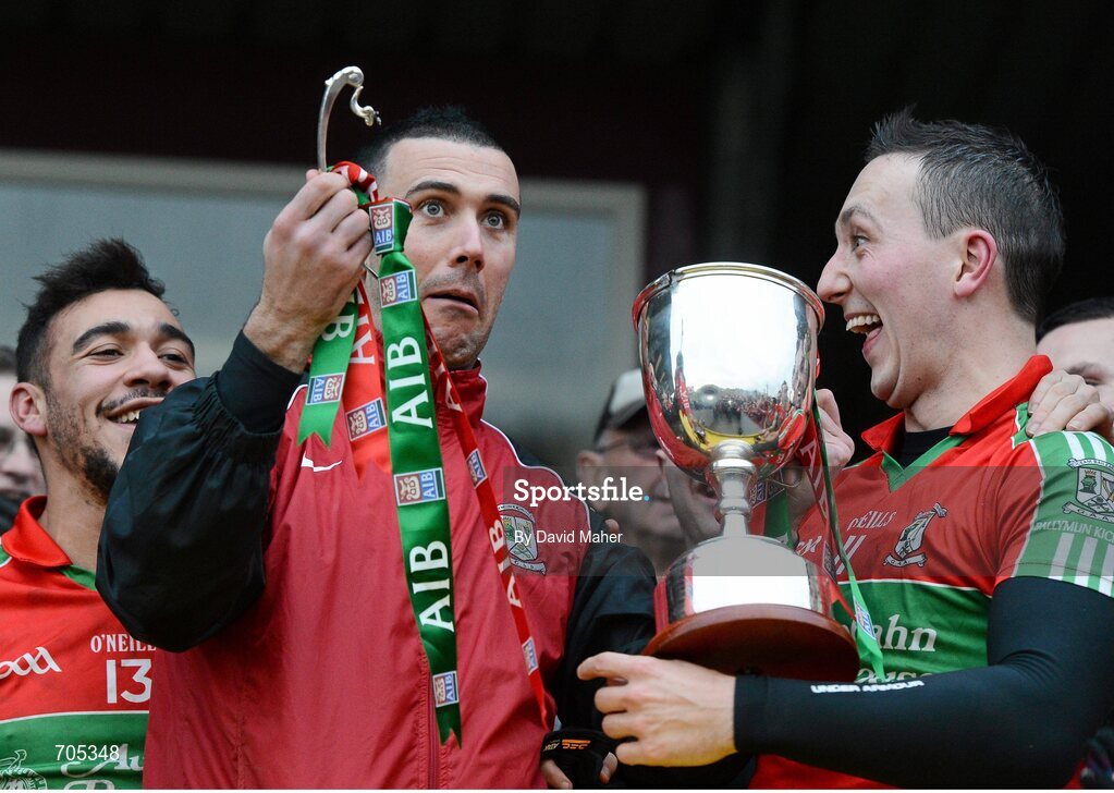 9 December 2012; Simon Lawlor, centre, Ballymun Kickhams, along with Ted Furman, left, and Kevin Leahy, right, holds the McCabe Cup in his left hand and the handle in his right, after it came apart during the presentation. AIB Leinster GAA Football Senior Club Championship Final, Portlaoise, Laois v Ballymun Kickhams, Dublin, Cusack Park, Mullingar, Co. Westmeath. Picture credit: David Maher / SPORTSFILE
