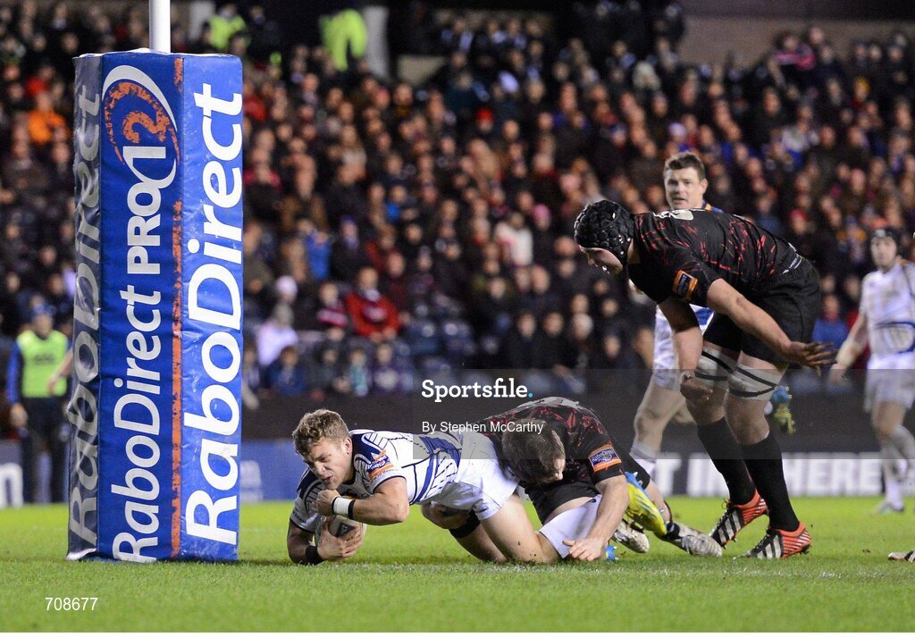 4 January 2013; Ian Madigan, Leinster, goes over to score his side's fourth try despite the attention of Steven Lawrie, Edinburgh. Celtic League 2012/13, Round 13, Edinburgh v Leinster, Murrayfield, Edinburgh, Scotland. Picture credit: Stephen McCarthy / SPORTSFILE