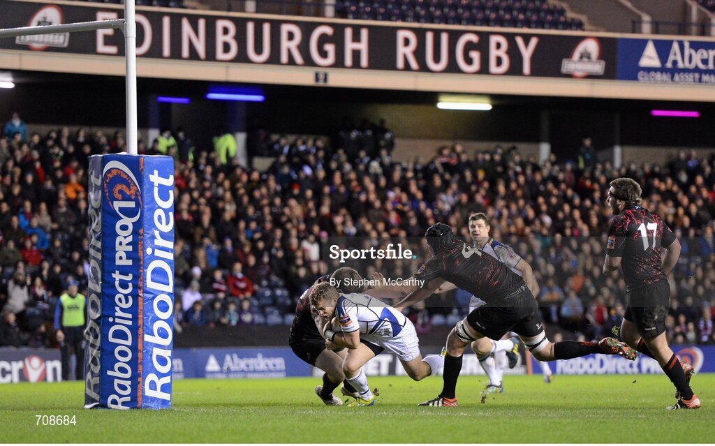 4 January 2013; Ian Madigan, Leinster, goes over to score his side's fourth try despite the attention of Steven Lawrie and Grant Gilchrist, 4, Edinburgh. Celtic League 2012/13, Round 13, Edinburgh v Leinster, Murrayfield, Edinburgh, Scotland. Picture credit: Stephen McCarthy / SPORTSFILE