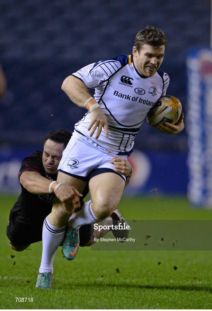 4 January 2013; Gordon D'Arcy, Leinster, is tackled by Ben Atiga, Edinburgh. Celtic League 2012/13, Round 13, Edinburgh v Leinster, Murrayfield, Edinburgh, Scotland. Picture credit: Stephen McCarthy / SPORTSFILE