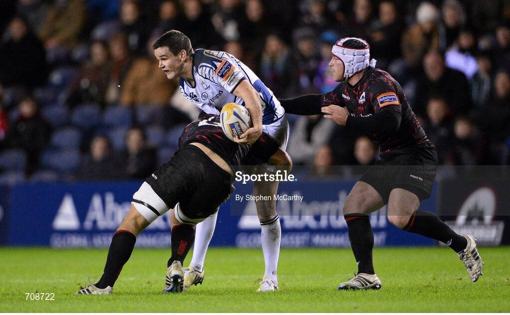 4 January 2013; Jonathan Sexton, Leinster, is tackled by Stuart McInally, left, and Andy Titterrell, Edinburgh. Celtic League 2012/13, Round 13, Edinburgh v Leinster, Murrayfield, Edinburgh, Scotland. Picture credit: Stephen McCarthy / SPORTSFILE