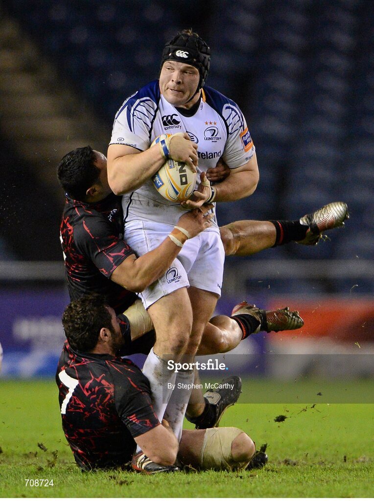 4 January 2013; Mike Ross, Leinster, is tackled by Dimitri Basilaia, 7, and Ben Atiga, Edinburgh. Celtic League 2012/13, Round 13, Edinburgh v Leinster, Murrayfield, Edinburgh, Scotland. Picture credit: Stephen McCarthy / SPORTSFILE