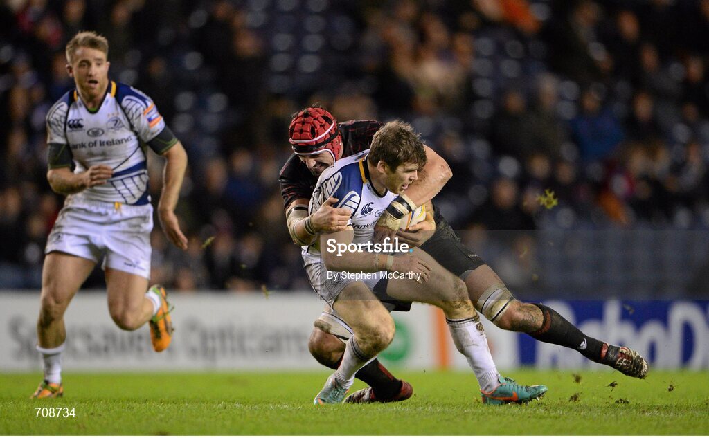 4 January 2013; Gordon D'Arcy, Leinster, is tackled by Sean Cox, Edinburgh. Celtic League 2012/13, Round 13, Edinburgh v Leinster, Murrayfield, Edinburgh, Scotland. Picture credit: Stephen McCarthy / SPORTSFILE