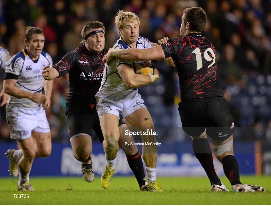 4 January 2013; Fionn Carr, Leinster, is tackled by Perry Parker, 19, and Robin Hislop, Edinburgh. Celtic League 2012/13, Round 13, Edinburgh v Leinster, Murrayfield, Edinburgh, Scotland. Picture credit: Stephen McCarthy / SPORTSFILE