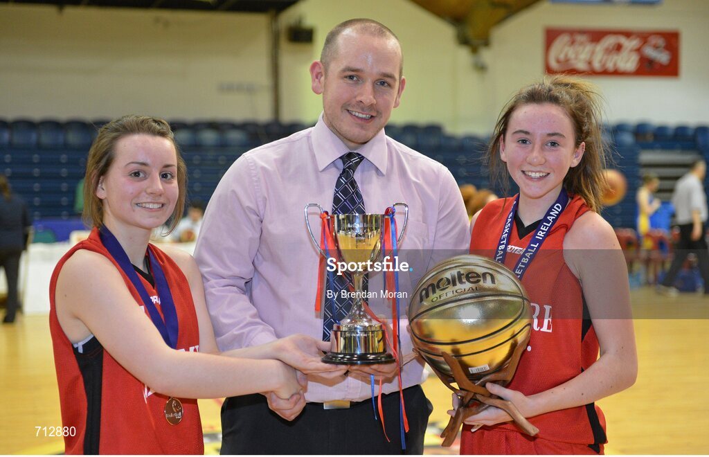 24 January 2013; Glanmire Community School co-captains Maeve O'Riordan, left, and Holly Herlihy, who was also named MVP, are presented with the cup by Conor Lilly, Competitions Officer, Basketball Ireland. All-Ireland Schools Cup U16B Girls Final, St. Patrick’s Academy Dungannon, Tyrone v Glanmire Community School, Cork, National Basketball Arena, Tallaght, Dublin. Picture credit: Brendan Moran / SPORTSFILE