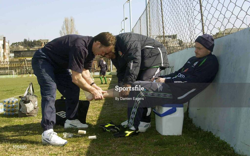 31 March 2003; Lee Carsley has his foot strapped up by Ciaran Murray, physiotherapist, before Republic of Ireland training. Tbilisi, Georgia. Picture credit; Damien Eagers / SPORTSFILE *EDI*