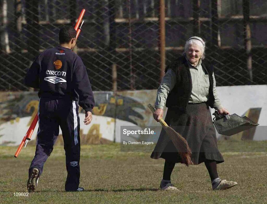31 March 2003; A local woman walks by as Chris Hughton, Assistant Manager, prepares for Republic of Ireland training. Tbilisi, Georgia. Picture credit; Damien Eagers / SPORTSFILE *EDI*