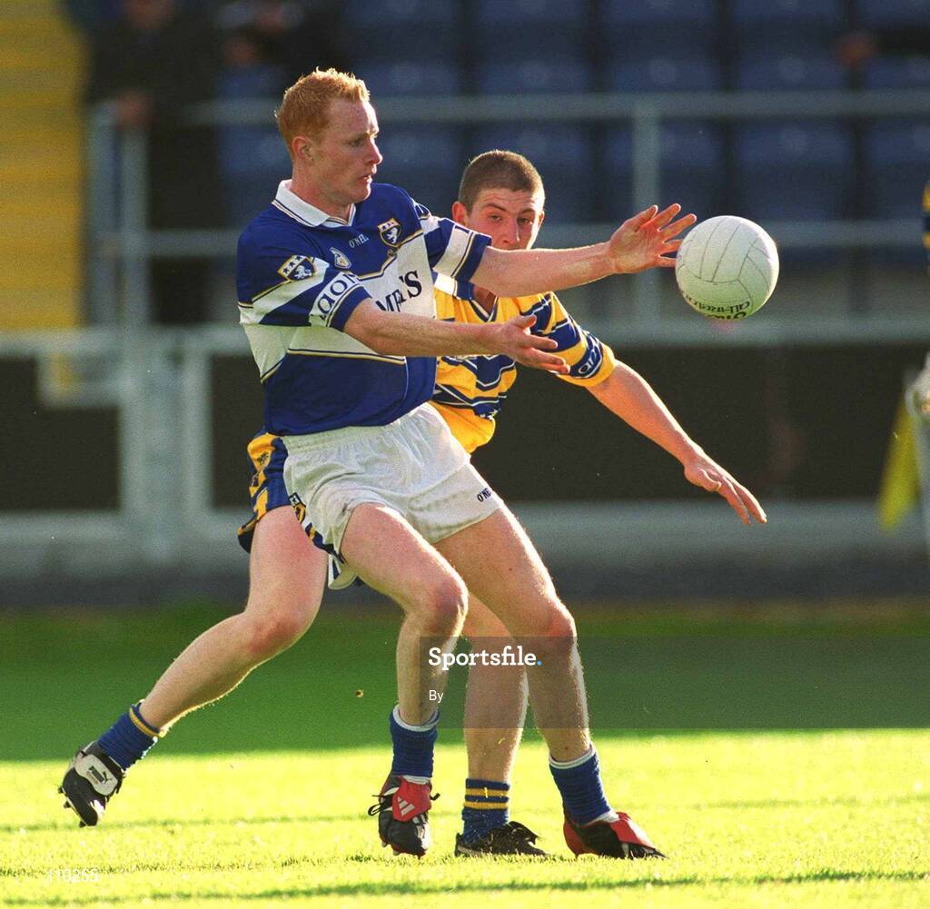 22 June 2002; Padraig Clancy, Laois, is tackled by Clare's David Russell. Clare v Laois, Bank of Ireland All-Ireland Senior Football Championship, Pearse Park, Portlaoise, Laois. Picture credit; Aoife Rice / SPORTSFILE