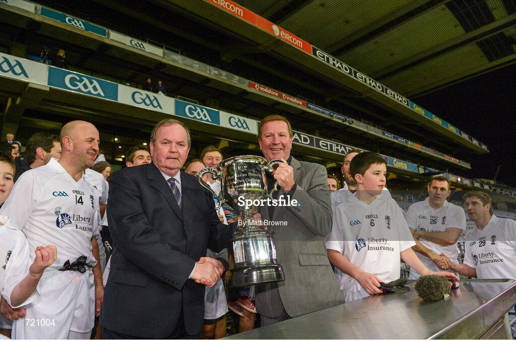 14 February 2013; Uachtarán Chumann Lúthchleas Gael Liam Ó Néill presents Kildare captain Ronnie Whelan with the cup after the Alan Kerins GAA Challenge, supported by Liberty Insurance, which took place in Croke Park on Valentine's Day. For more information visit alankerinsprojects.org. Croke Park, Dublin. Picture credit: Matt Browne / SPORTSFILE