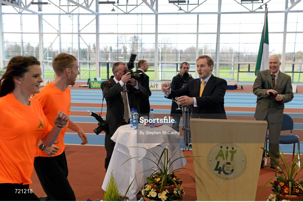 15 February 2013; An Taoiseach Enda Kenny T.D. offers water to AIT athletics students at the official opening of the Athlone Institute of Technology International Arena. Athlone Institute of Technology International Arena, Athlone, Co. Westmeath. Picture credit: Stephen McCarthy / SPORTSFILE
