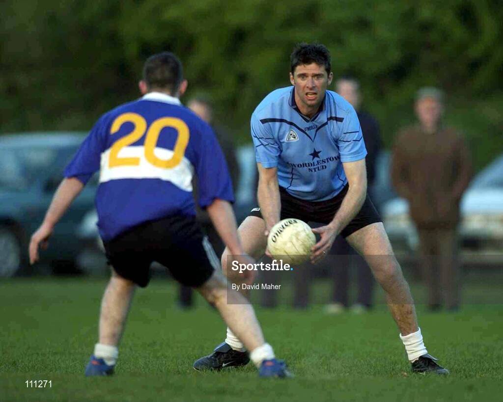 23 April 2003; Former Irish soccer International Niall Quinn, Eadestown, is opposed by Rathcoffey's David  Burns. Kildare Junior Football League, Eadestown v Rathcoffey, Naas, Co. Kildare. Picture credit; Dave Maher / SPORTSFILE *EDI*