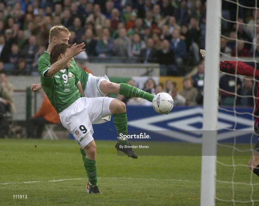 30 April 2003; Republic of Ireland's Damien Duff scores his sides only goal against Norway, despite the presence of team-mate David Connolly (9). Friendly International, Republic of Ireland v Norway, Lansdowne Road, Dublin. Soccer. Picture credit; Brendan Moran / SPORTSFILE *EDI*