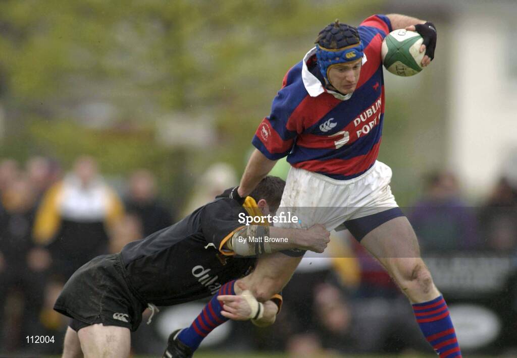 3 May 2003; Ollie Winchester, Clontarf, is tackled by Buccaneers Ted Robinson. AIB All-Ireland League Division One play-off, Clontarf v Buccaneers, Castle Avenue, Clontarf, Dublin. Picture credit; Matt Browne / SPORTSFILE *EDI*