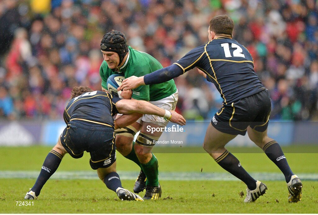 24 February 2013; Sean O'Brien, Ireland, is tackled by Ruaridh Jackson, left, and Matt Scott, Scotland. RBS Six Nations Rugby Championship, Scotland v Ireland, Murrayfield Stadium, Edinburgh, Scotland. Picture credit: Brendan Moran / SPORTSFILE