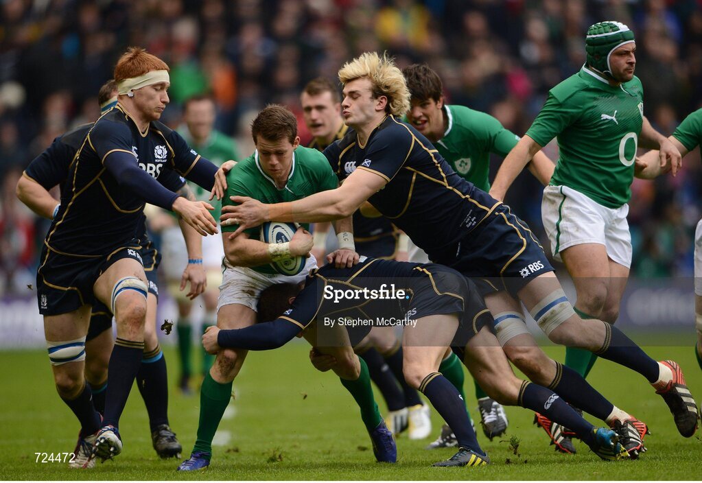 24 February 2013; Craig Gilroy, Ireland, is tackled by Scotland players, from left, Rob Harley, Greig Laidlaw and Richie Gray. RBS Six Nations Rugby Championship, Scotland v Ireland, Murrayfield Stadium, Edinburgh, Scotland. Picture credit: Stephen McCarthy / SPORTSFILE