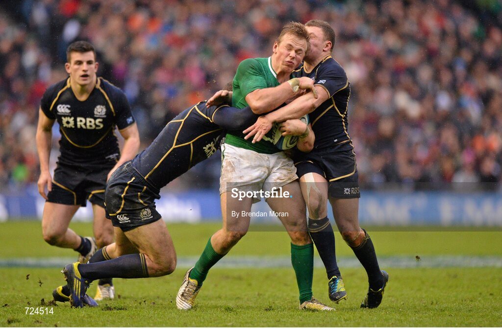 24 February 2013; Luke Marshall, Ireland, is tackled by Tim Visser, left, and Duncan Weir, Scotland. RBS Six Nations Rugby Championship, Scotland v Ireland, Murrayfield Stadium, Edinburgh, Scotland. Picture credit: Brendan Moran / SPORTSFILE