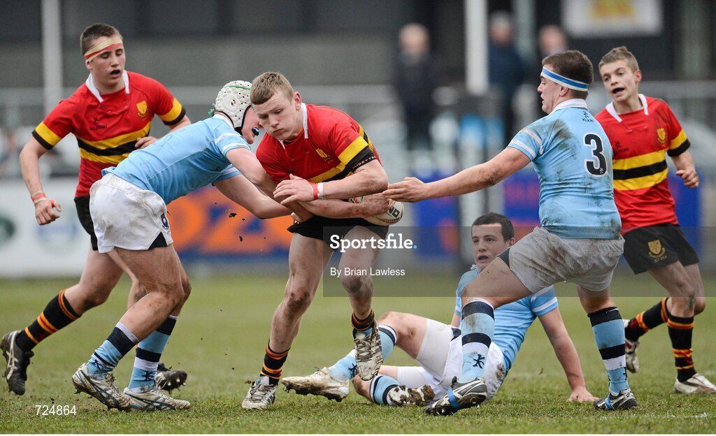 26 February 2013; William Fay, CBC Monkstown, is tackled by Ronan Kelleher, left, and Sam Griffen, St. Michael’s College. Powerade Leinster Schools Junior Cup, Quarter-Final, St. Michael’s College v CBC Monkstown, Donnybrook Stadium, Donnybrook, Dublin. Picture credit: Brian Lawless / SPORTSFILE