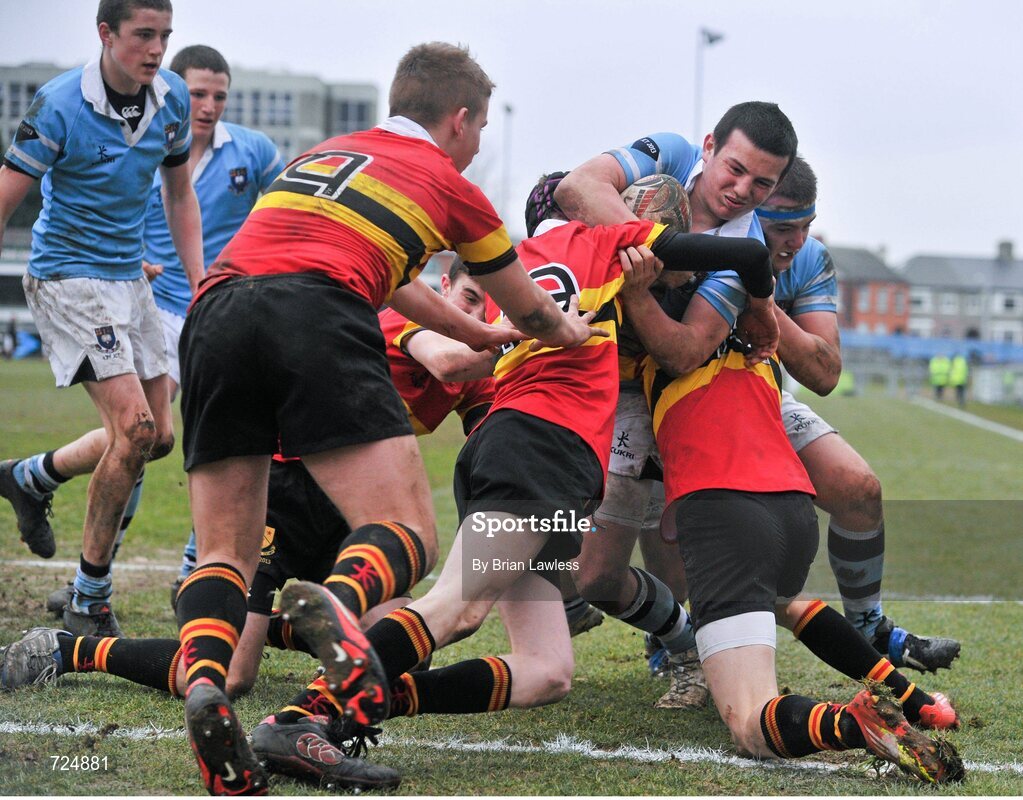 26 February 2013; Robert Duffy, St. Michael’s College, on his way to scoring his side's first try despite the attempts of, from left, Patrick Jennings, Tom Kelly, and Darragh Porter, CBC Monkstown. Powerade Leinster Schools Junior Cup, Quarter-Final, St. Michael’s College v CBC Monkstown, Donnybrook Stadium, Donnybrook, Dublin. Picture credit: Brian Lawless / SPORTSFILE