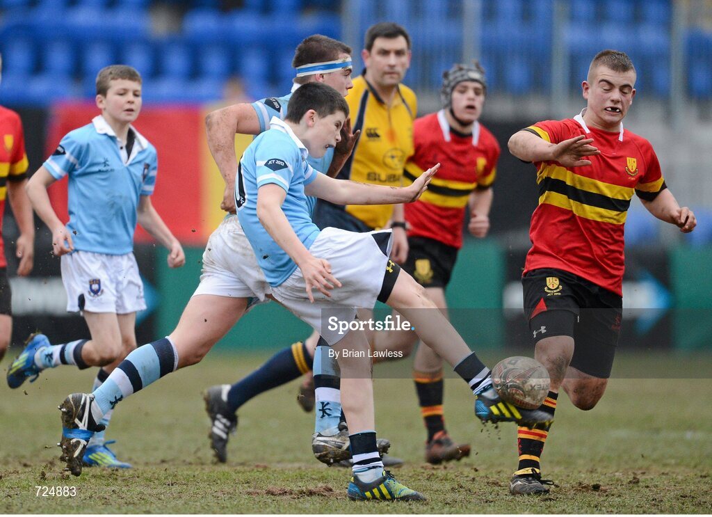 26 February 2013; Harry Byrne, St. Michael’s College, clears under pressure from Alex Holmes, CBC Monkstown. Powerade Leinster Schools Junior Cup, Quarter-Final, St. Michael’s College v CBC Monkstown, Donnybrook Stadium, Donnybrook, Dublin. Picture credit: Brian Lawless / SPORTSFILE