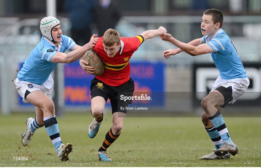 26 February 2013; Darragh Spillane, CBC Monkstown, is tackled by Ronan Kelleher, left, and James Hickey, St. Michael’s College. Powerade Leinster Schools Junior Cup, Quarter-Final, St. Michael’s College v CBC Monkstown, Donnybrook Stadium, Donnybrook, Dublin. Picture credit: Brian Lawless / SPORTSFILE