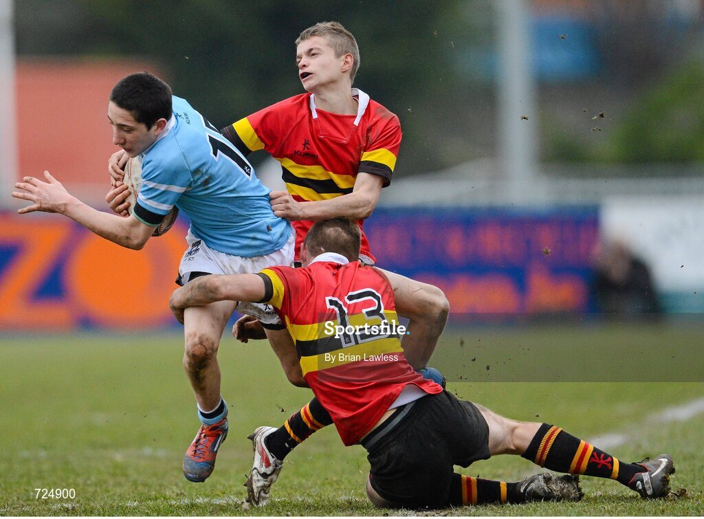 26 February 2013; Michael Heaney, St. Michael’s College, is tackled by Dan Casey, bottom, and Robert Jordan, CBC Monkstown. Powerade Leinster Schools Junior Cup, Quarter-Final, St. Michael’s College v CBC Monkstown, Donnybrook Stadium, Donnybrook, Dublin. Picture credit: Brian Lawless / SPORTSFILE