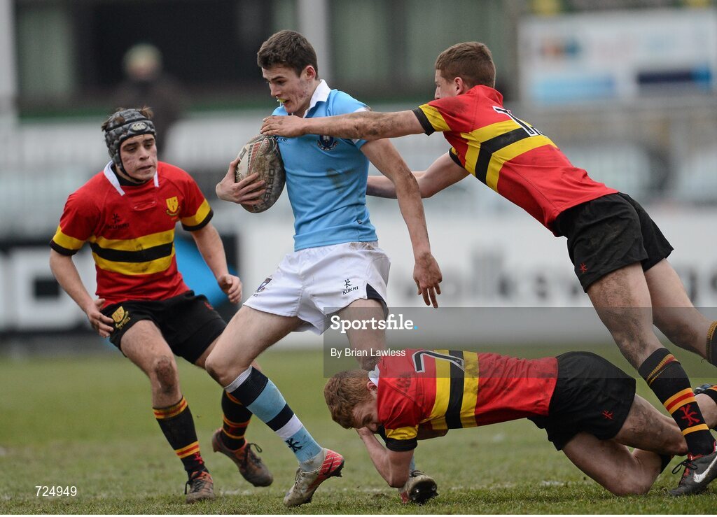 26 February 2013; Jack Kelly, St. Michael’s College, is tackled by Thomas O'Callaghan and Dan Casey, CBC Monkstown. Powerade Leinster Schools Junior Cup, Quarter-Final, St. Michael’s College v CBC Monkstown, Donnybrook Stadium, Donnybrook, Dublin. Picture credit: Brian Lawless / SPORTSFILE