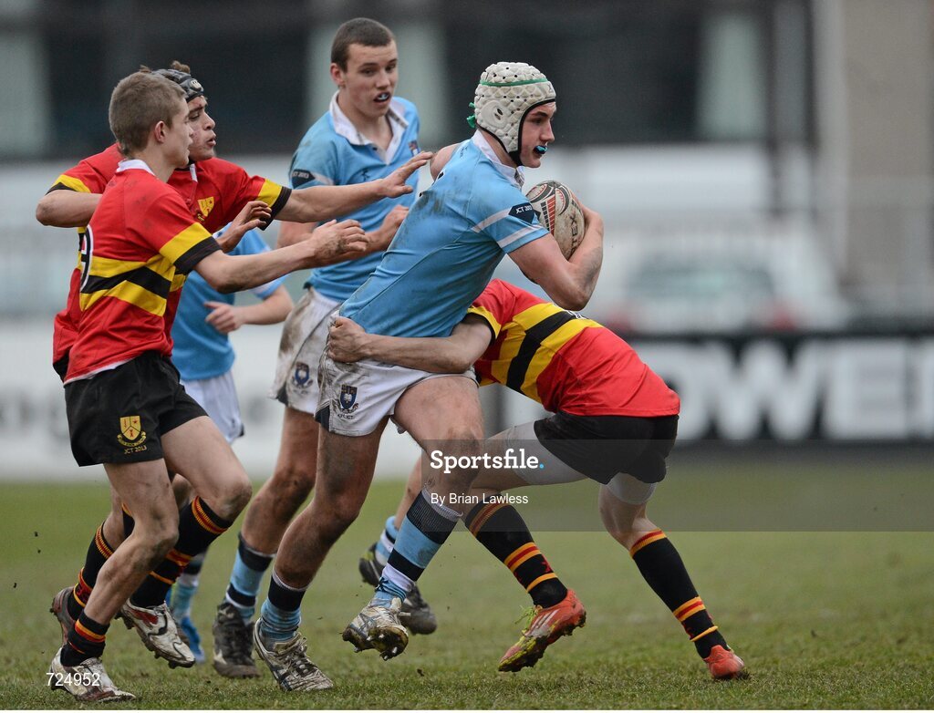 26 February 2013; Ronan Kelleher, St. Michael’s College, is tackled by Harry McIntyre and Peter O'Beirne, left, CBC Monkstown. Powerade Leinster Schools Junior Cup, Quarter-Final, St. Michael’s College v CBC Monkstown, Donnybrook Stadium, Donnybrook, Dublin. Picture credit: Brian Lawless / SPORTSFILE