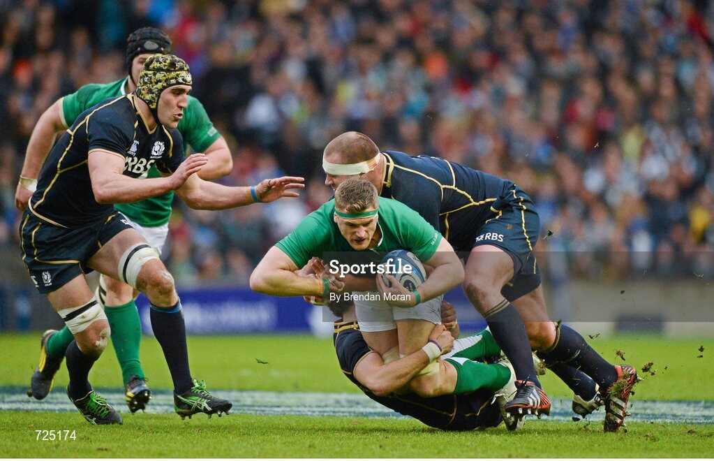 24 February 2013; Jamie Heaslip, Ireland, is tackled by Ruaridh Jackson and Geoff Cross, Scotland. RBS Six Nations Rugby Championship, Scotland v Ireland, Murrayfield Stadium, Edinburgh, Scotland. Picture credit: Brendan Moran / SPORTSFILE