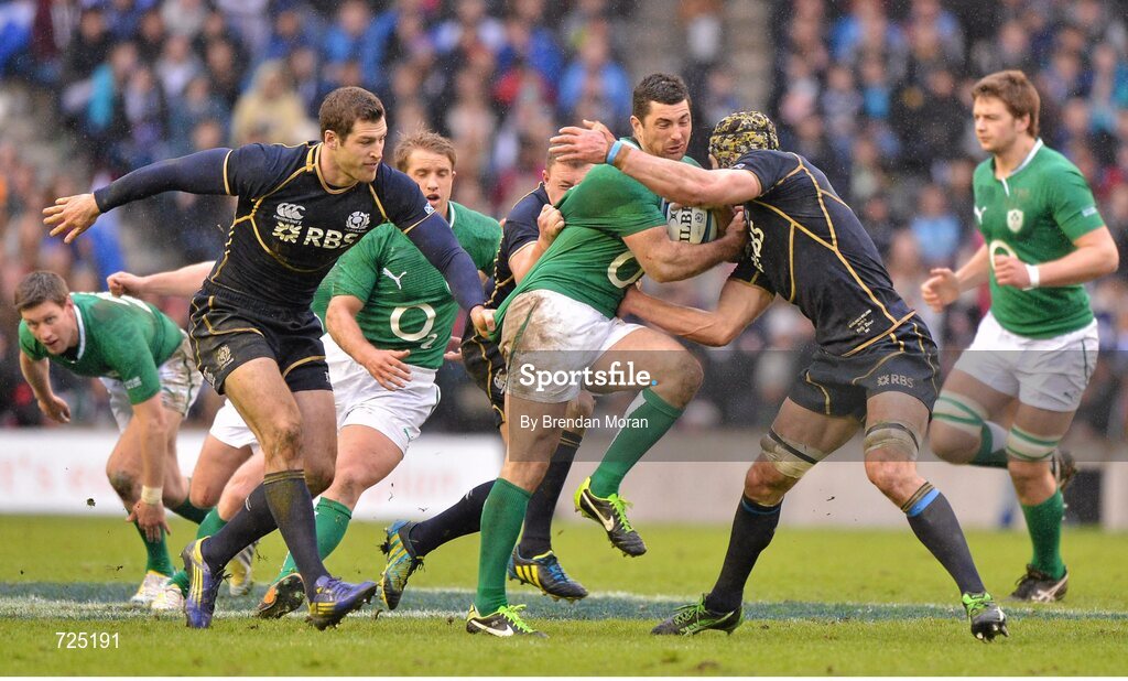 24 February 2013; Rob Kearney, Ireland, is tackled by Tim Visser, left, Duncan Weir and Kelly Brown, Scotland. RBS Six Nations Rugby Championship, Scotland v Ireland, Murrayfield Stadium, Edinburgh, Scotland. Picture credit: Brendan Moran / SPORTSFILE