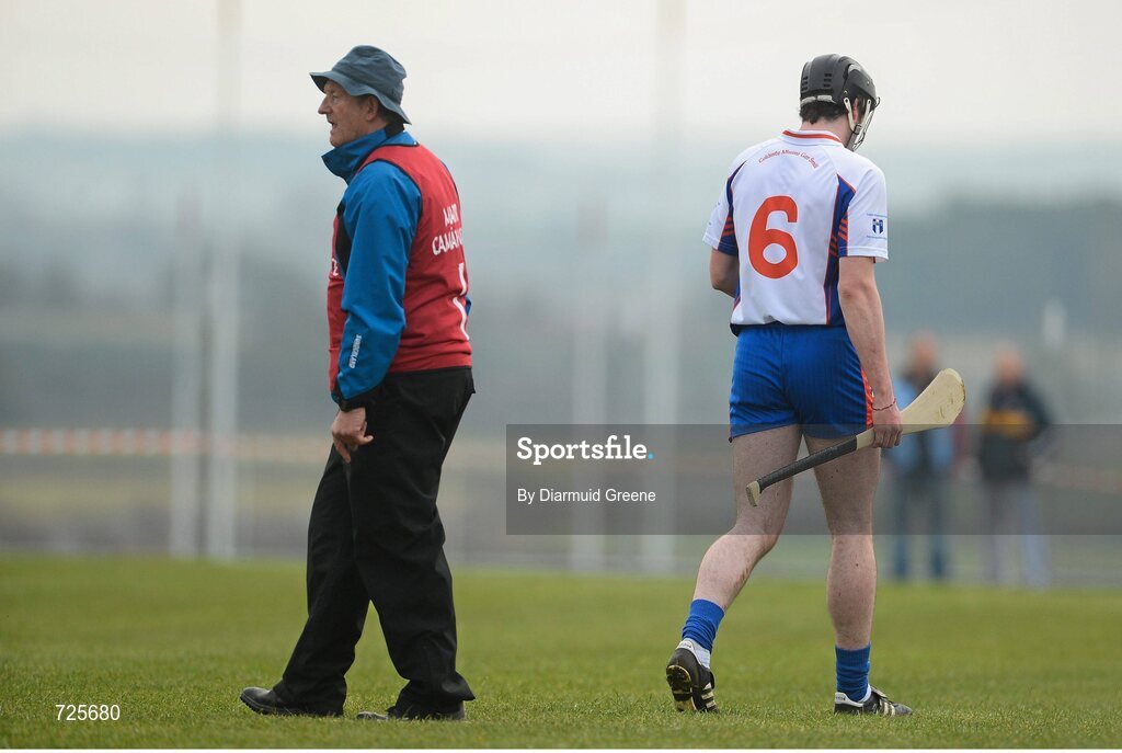 1 March 2013; Declan Hannon, Mary Immaculate College, Limerick, alongside manager Eamonn Cregan, after he was shown a straight red card by referee James McGrath. Irish Daily Mail Fitzgibbon Cup Semi-Final, Waterford Institute of Technology v Mary Immaculate College, Limerick, Carnmore GAA Club, Carnmore, Co. Galway. Picture credit: Diarmuid Greene / SPORTSFILE