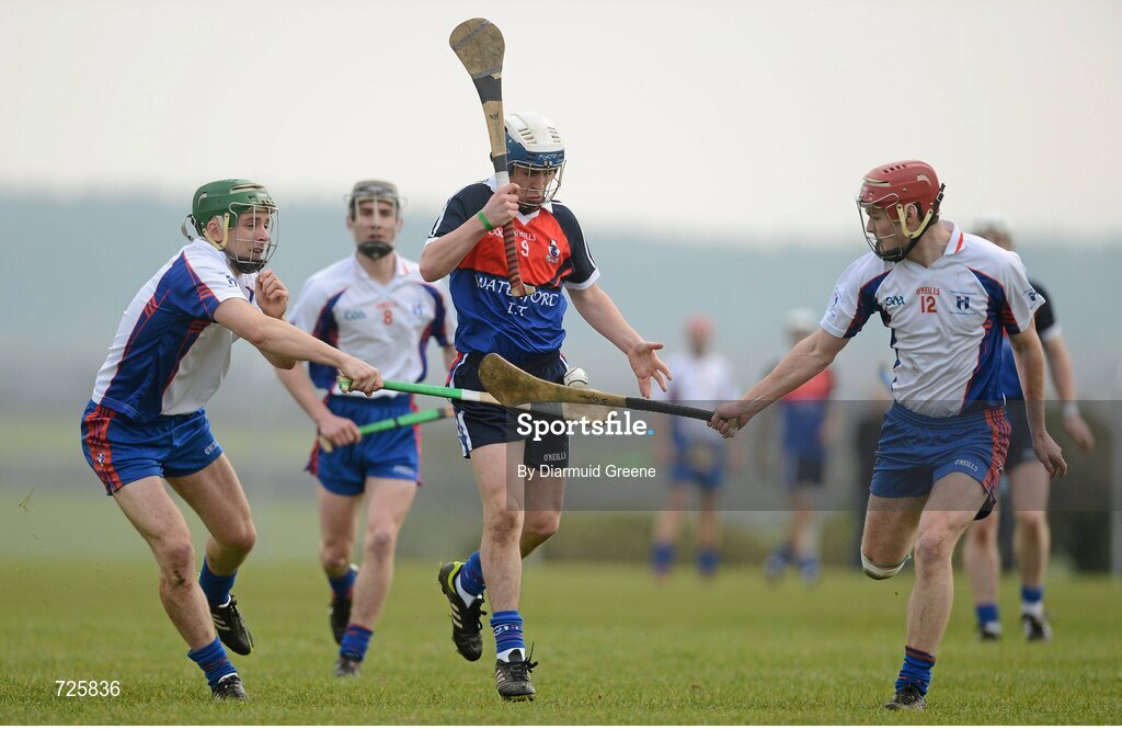 1 March 2013; Stephen Roche, Waterford Institute of Technology, in action against Jamie Wall, left, and Sean Curran, Mary Immaculate College, Limerick. Irish Daily Mail Fitzgibbon Cup Semi-Final, Waterford Institute of Technology v Mary Immaculate College, Limerick, Carnmore GAA Club, Carnmore, Co. Galway. Picture credit: Diarmuid Greene / SPORTSFILE