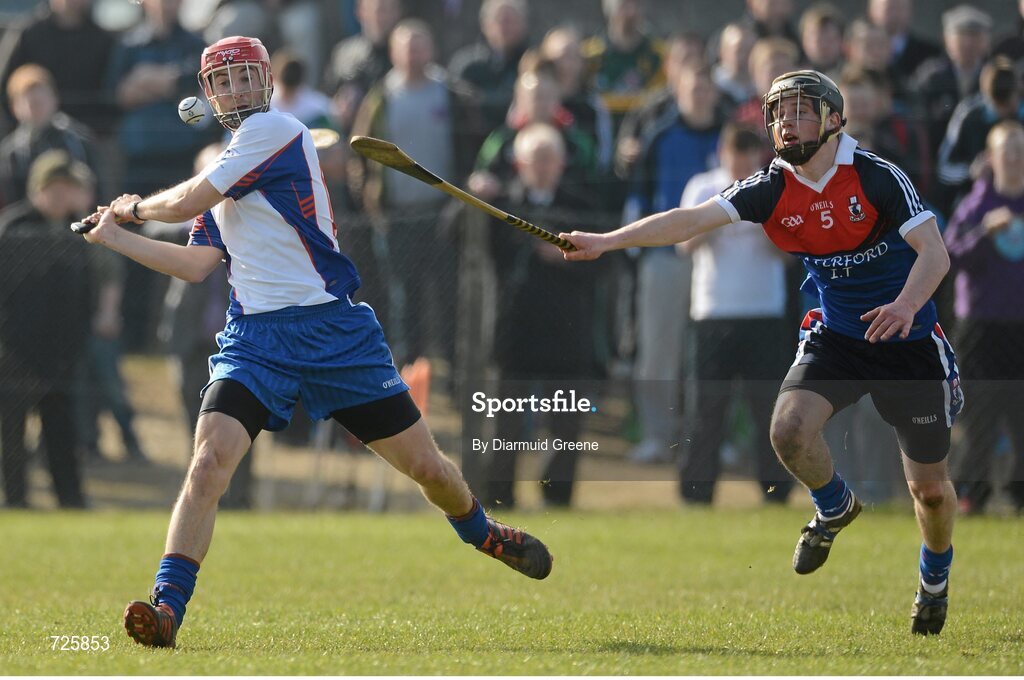 1 March 2013; Luke O'Farrell, Mary Immaculate College, Limerick, shoots to score a late second half point despite the efforts of Ciaran Haugh, Waterford Institute of Technology. Irish Daily Mail Fitzgibbon Cup Semi-Final, Waterford Institute of Technology v Mary Immaculate College, Limerick, Carnmore GAA Club, Carnmore, Co. Galway. Picture credit: Diarmuid Greene / SPORTSFILE