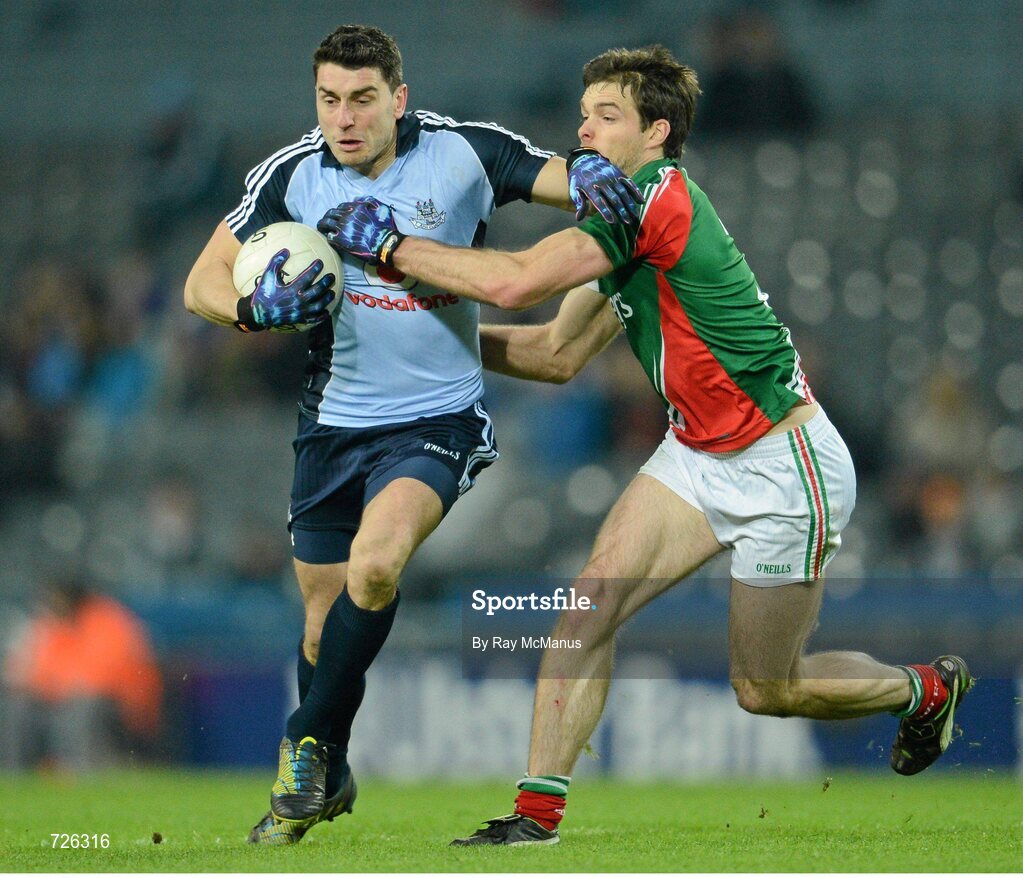 2 March 2013; Bernard Brogan, Dublin, is tackled by Mayo full back Ger Cafferkey. Mayo. Allianz Football League, Division 1, Dublin v Mayo, Croke Park, Dublin. Picture credit: Ray McManus / SPORTSFILE