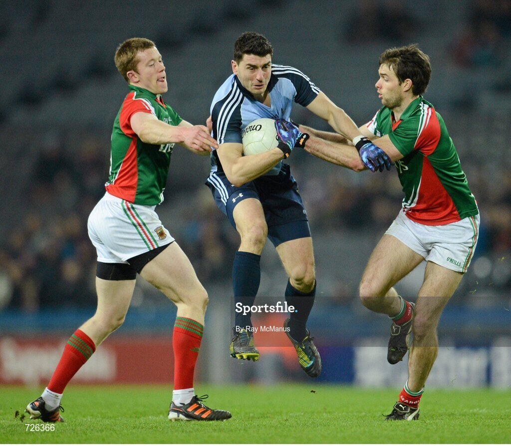 2 March 2013; Bernard Brogan, Dublin, is tackled by Mayo defenders Donal Vaughan, left, and Ger Cafferkey. Allianz Football League, Division 1, Dublin v Mayo, Croke Park, Dublin. Picture credit: Ray McManus / SPORTSFILE