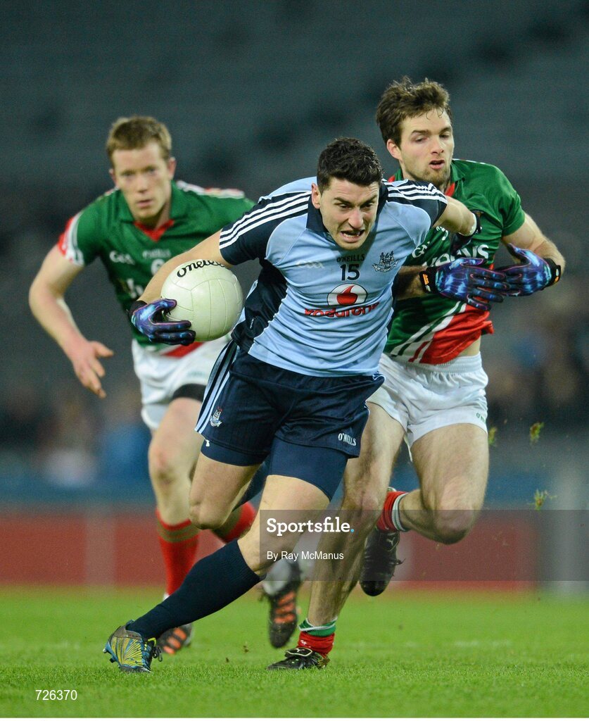 2 March 2013; Bernard Brogan, Dublin, is tackled by Mayo full back Ger Cafferkey. Allianz Football League, Division 1, Dublin v Mayo, Croke Park, Dublin. Picture credit: Ray McManus / SPORTSFILE