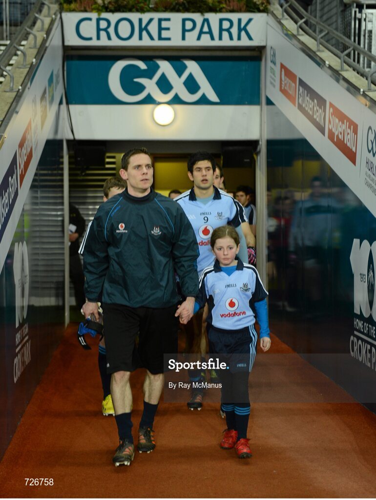2 March 2013; The Dublin captain Stephen Cluxton and mascot Caoimhe Keohane, aged nine, from Scoil Uí Chonaill, lead out the team. Allianz Football League, Division 1, Dublin v Mayo, Croke Park, Dublin. Picture credit: Ray McManus / SPORTSFILE