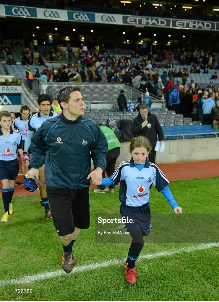 2 March 2013; The Dublin captain Stephen Cluxton and mascot Caoimhe Keohane, aged nine, from Scoil Uí Chonaill, lead out the team. Allianz Football League, Division 1, Dublin v Mayo, Croke Park, Dublin. Picture credit: Ray McManus / SPORTSFILE