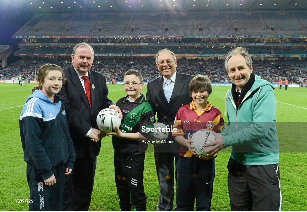 2 March 2013; Uachtarán Chumann Lúthchleas Gael Liam Ó Néill, in the company of Donal Bollard, Allianz Ireland, and Edward O'Riordan, Chairman of Cumann na mBunscoil, right, makes a presentation to exceptional players from the Allianz Cumann na mBunscoil finals. The recipients are left to right; Ciara Holland, aged 12, St Helen's Portmarnock, Nathan Burke, aged 12, Scoil Fhursa, Kilmore West, and Neil Rock, aged 12, Rush National School. Allianz Football League, Division 1, Dublin v Mayo, Croke Park, Dublin. Picture credit: Ray McManus / SPORTSFILE