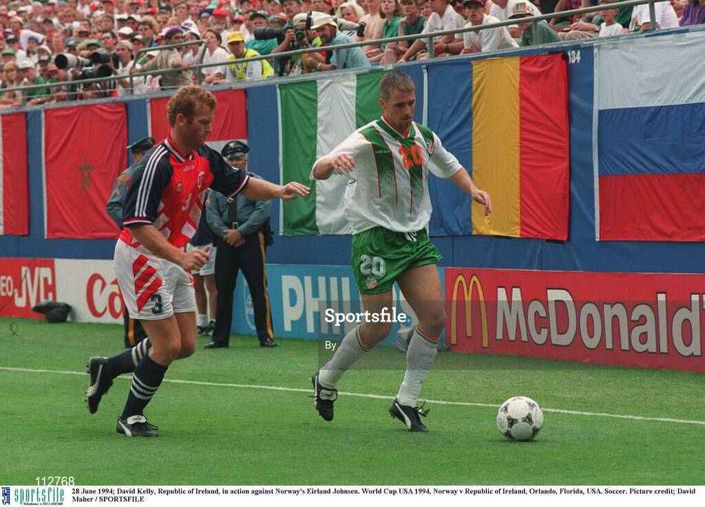 28 June 1994; David Kelly, Republic of Ireland, in action against Norway's Eirland Johnsen. World Cup USA 1994, Norway v Republic of Ireland, Orlando, Florida, USA. Soccer. Picture credit; David Maher / SPORTSFILE