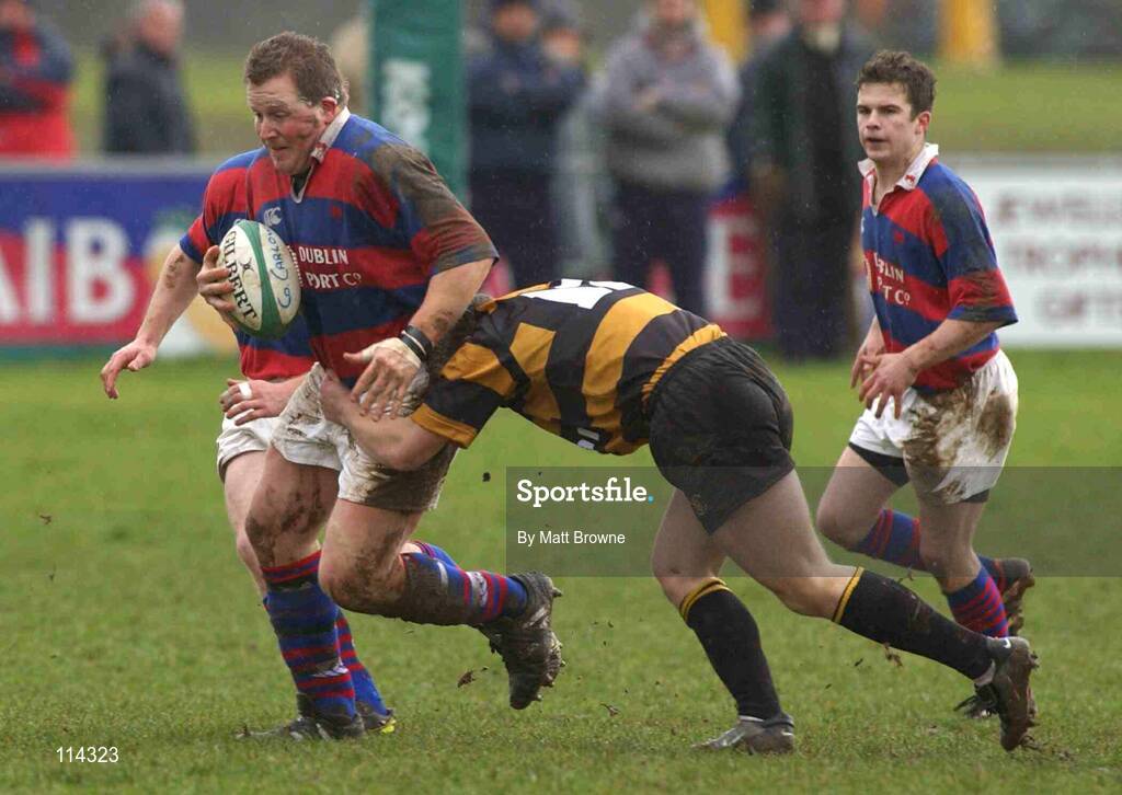 1 March 2003; Adrian Clarke, Clontarf, is tackled by Maurice Logue, Carlow. AIB League Division One, County Carlow v Clontarf, Oak Park, Co. Carlow. Picture credit; Matt Browne / SPORTSFILE *EDI*