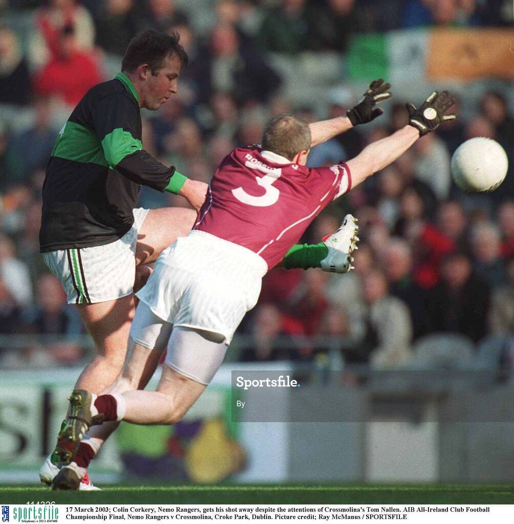 17 March 2003; Colin Corkery, Nemo Rangers, gets his shot away despite the attentions of Crossmolina's Tom Nallen. AIB All-Ireland Club Football Championship Final, Nemo Rangers v Crossmolina, Croke Park, Dublin. Picture credit; Ray McManus / SPORTSFILE