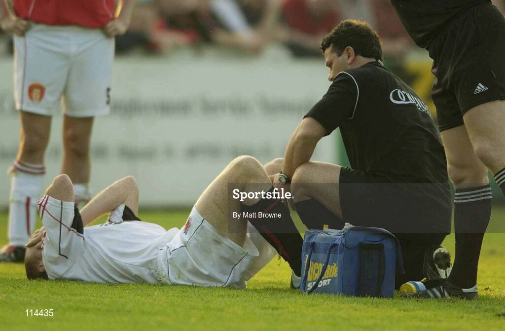30 May 2003; Glen Crowe, Bohemians, receives treatment from the Bohemians physio before leaving the field. eircom league, Premier Division, St. Patrick's Athletic v Bohemians, Richmond Park, Dublin. Soccer. Picture credit; Matt Browne / SPORTSFILE *EDI*