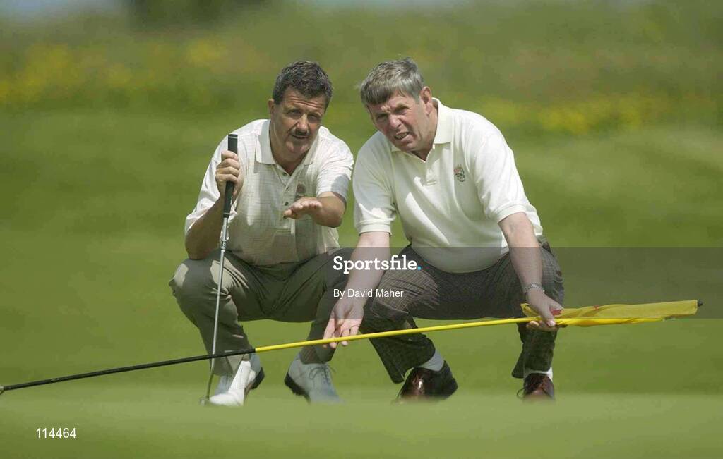 31 May 2003; Adrian Morrow, left, Portmarnock, Co. Dublin, lines up his putt with his caddie, David Hepburn, on the 18th green during the Irish Independent East of Ireland Amateur Open Championship, Co. Louth Golf Club, Baltray, Co. Louth. Golf. Picture credit; David Maher / SPORTSFILE *EDI*