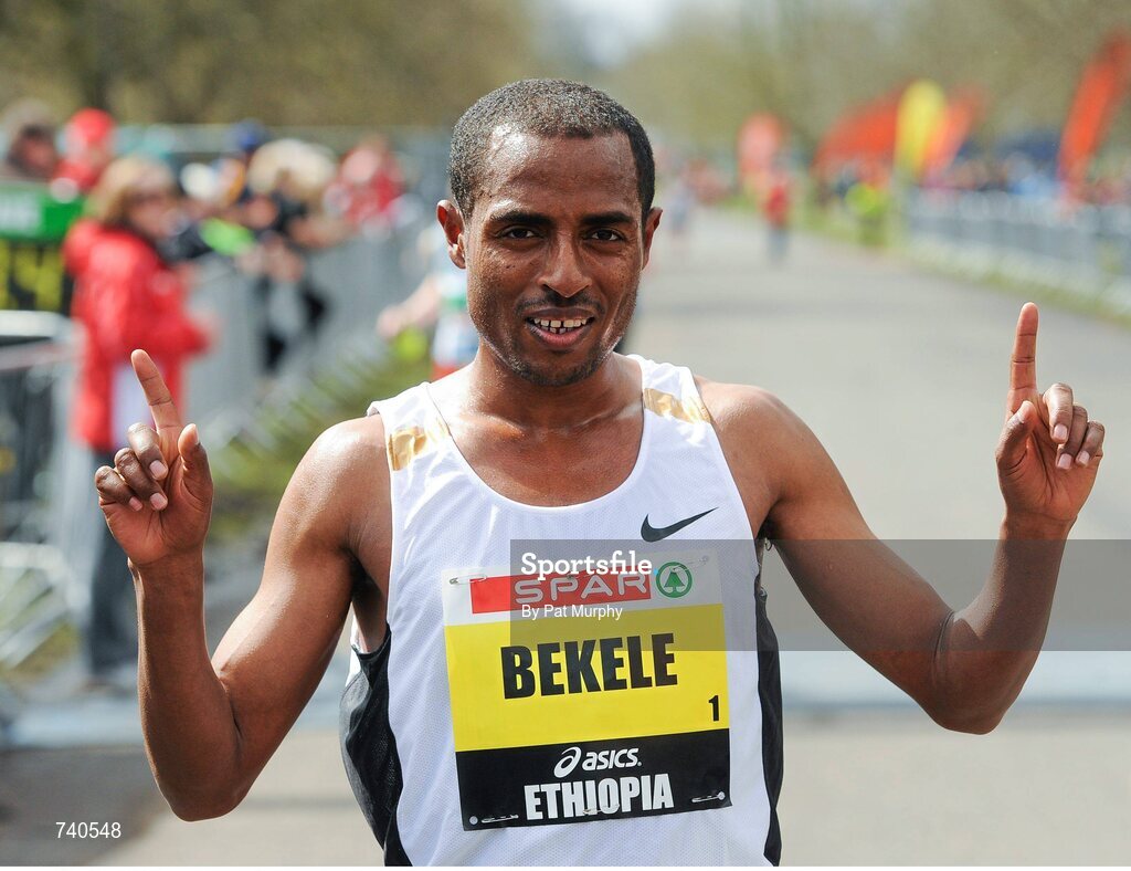 14 April 2013; Kenenisa Bekele, Ethiopia, celebrates after winning the SPAR Great Ireland Run 2013. Phoenix Park, Dublin. Picture credit: Pat Murphy / SPORTSFILE