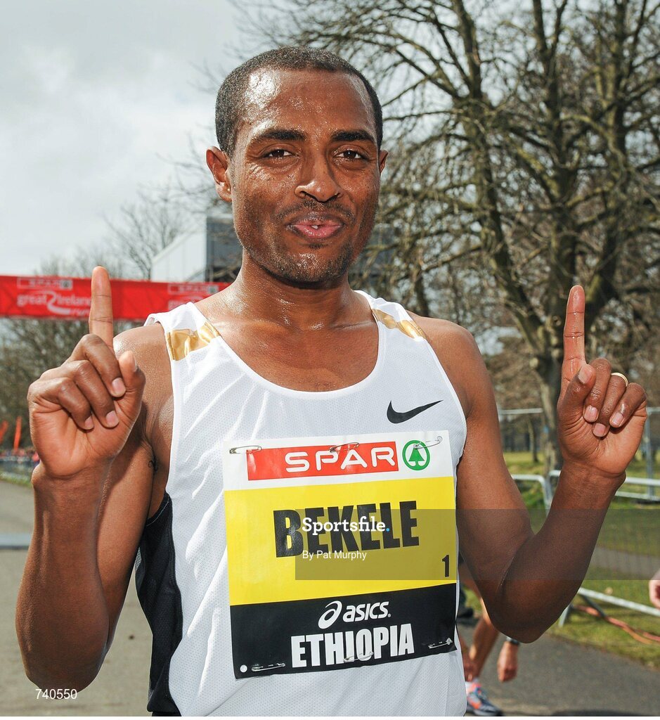14 April 2013; Kenenisa Bekele, Ethiopia, celebrates after winning the SPAR Great Ireland Run 2013. Phoenix Park, Dublin. Picture credit: Pat Murphy / SPORTSFILE