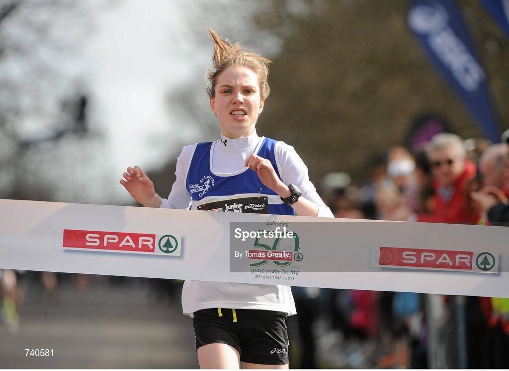 14 April 2013; Síofra O'Flaherty, St. Laurence O'Toole A.C, Co. Carlow, approaches the line to win the SPAR Mini Great Ireland Run 2013. Phoenix Park, Dublin. Picture credit: Tomás Greally / SPORTSFILE