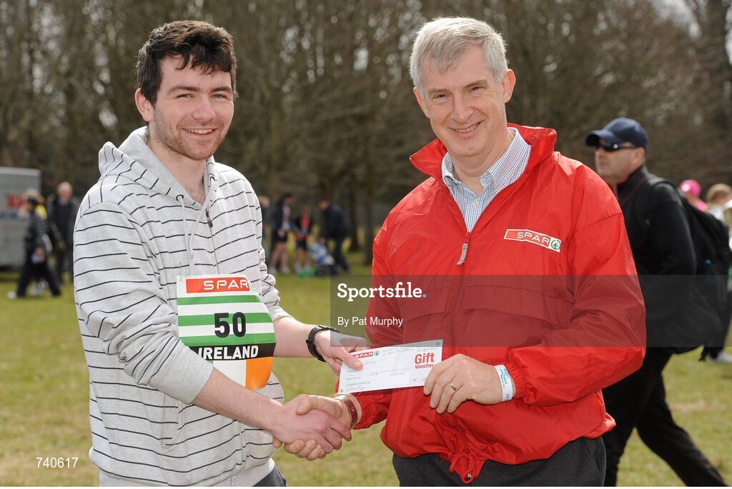 14 April 2013; Mark Shipley, from Drimnagh, Dublin, left, is presented with a SPAR voucher by Willie O'Byrne, Managing Director of SPAR Ireland, before the SPAR Great Ireland Run 2013. Phoenix Park, Dublin. Picture credit: Pat Murphy / SPORTSFILE