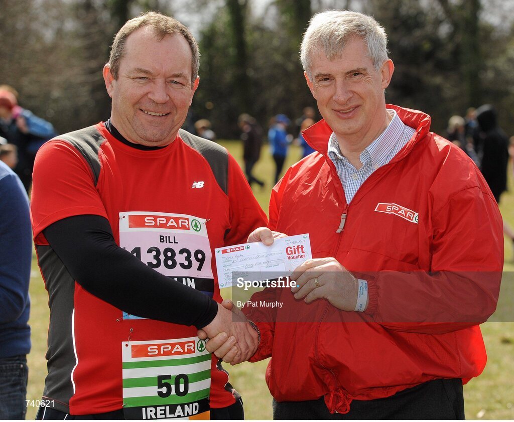 14 April 2013; Bill Ryan, from Clarehall, Dublin, is presented with a SPAR voucher by Willie O'Byrne, Managing Director of SPAR Ireland, for competing in the SPAR Great Ireland Run 2013 on his 50th birthday. Phoenix Park, Dublin. Picture credit: Pat Murphy / SPORTSFILE